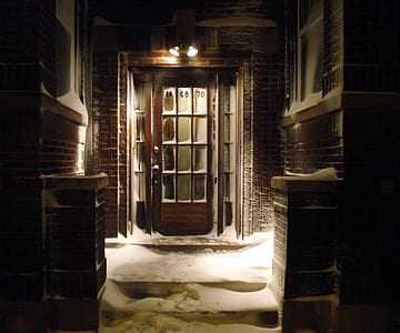 snow covered house during night thumbnail