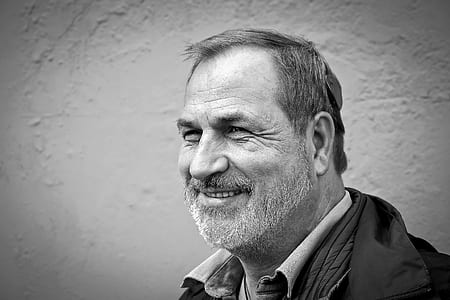 grayscale photo of man smiling thumbnail