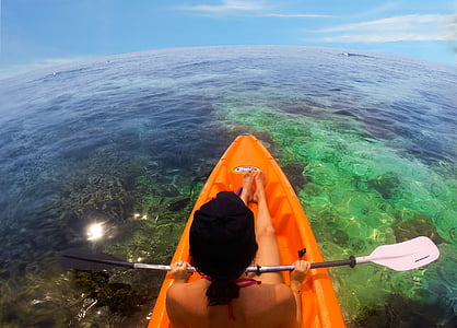 woman riding on orange kayak thumbnail