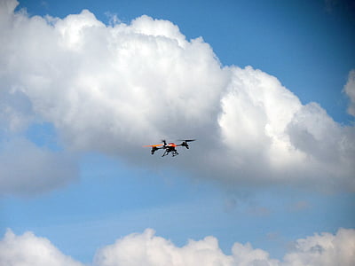 black and red quadcopter in flight thumbnail
