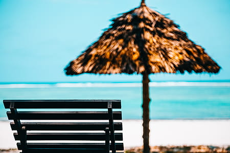Beach Lounge Chair With Straw Parasol thumbnail