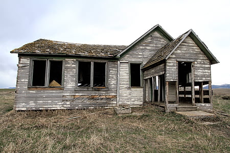 shallow photography of abandoned gray plank house thumbnail