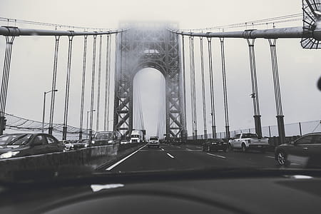 Grayscale Photography of Cars on Bridge thumbnail
