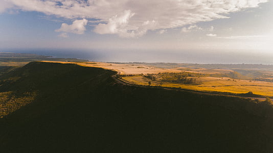 aerial photography of land under clouds thumbnail