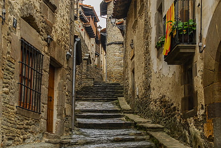 concrete stairs between buildings during day thumbnail