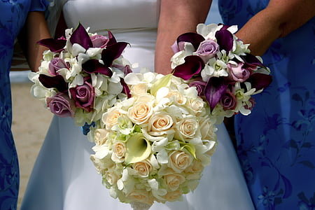 bride holding white flower bouquet thumbnail