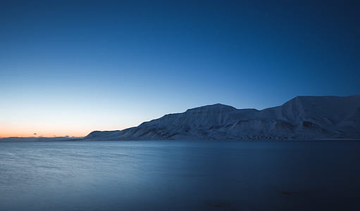 body of water across mountain thumbnail