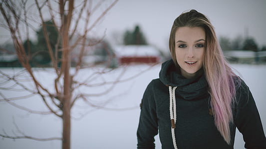 woman standing near bear tree thumbnail