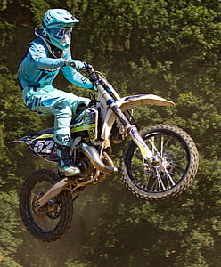 person riding on dirt bike during daytime thumbnail