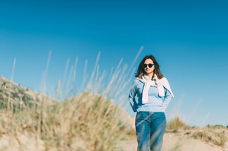 man standing on ground front of green grass at daytime thumbnail