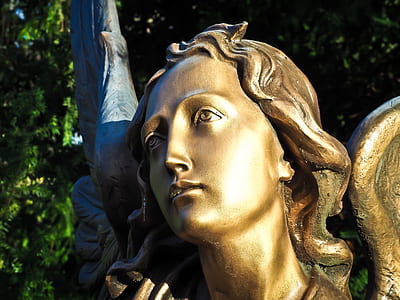 brown female statue at daytime thumbnail