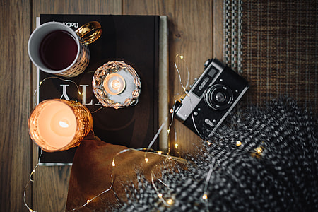 Old camera, mug with tea and books thumbnail