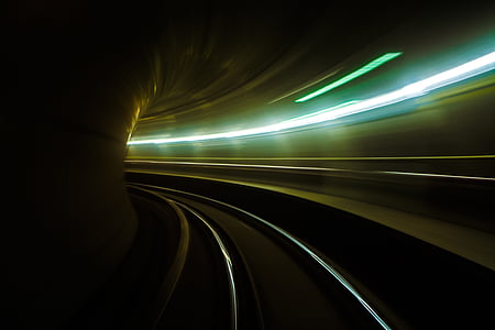 timelapse photography of railtrack inside tunnel thumbnail