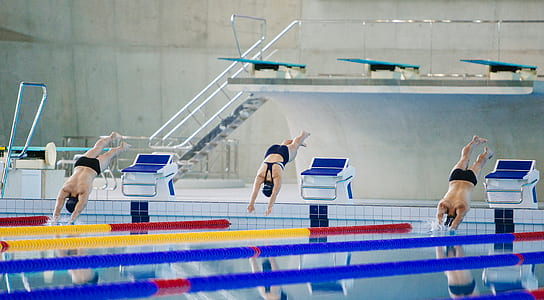 three person diving in swimming pool thumbnail