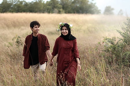 Man and Woman on Grass Field thumbnail