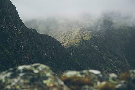 green mountain covered with fog thumbnail