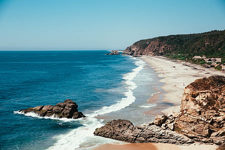 Blue Ocean With Sandy Beach Photo thumbnail