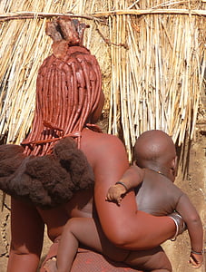 woman carrying child on her right side thumbnail