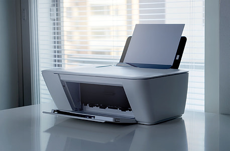 printer paper on white desktop printer thumbnail