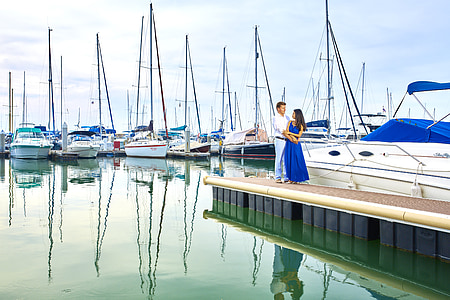 man and woman on brown dock thumbnail