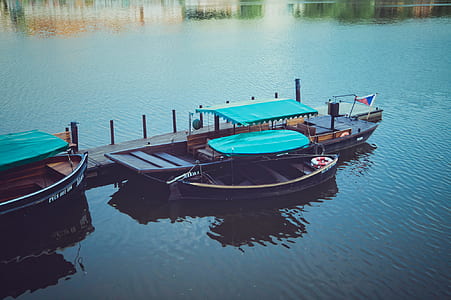 boats docked on a dock during day time thumbnail