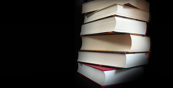 books piled up thumbnail