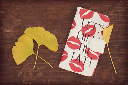 three yellow leaves beside pink and white kissmark pattern leather flip case thumbnail