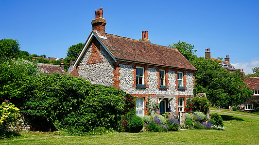 photography of brown and gray house during daytime thumbnail