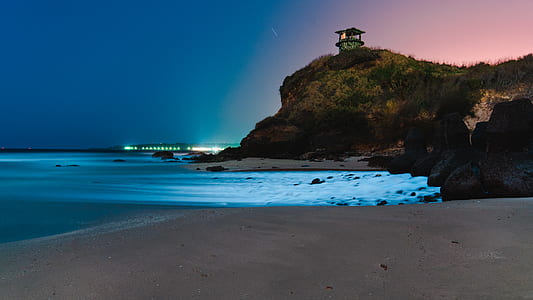 ocean shore view during night time thumbnail