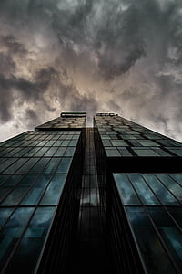high rise building under dark sky thumbnail