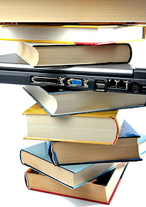 laptop in pile of books thumbnail