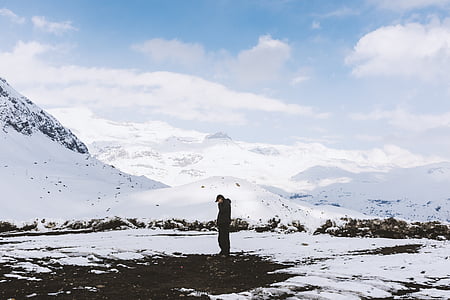 man standing on snow covered gound thumbnail
