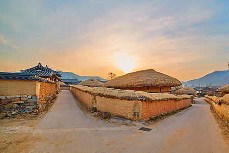 landscape photography of houses during sunrise thumbnail