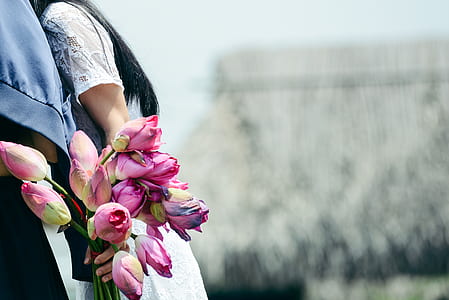 woman holding purple flower bouquet thumbnail