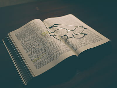 eyeglasses placed on open bible thumbnail