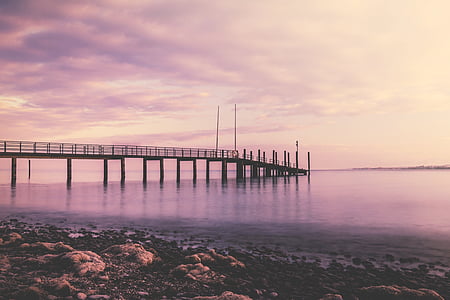 dock on calm body of water thumbnail