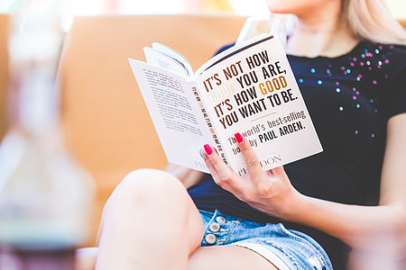 Young Girl Reading a World’s Best-Seller Book thumbnail