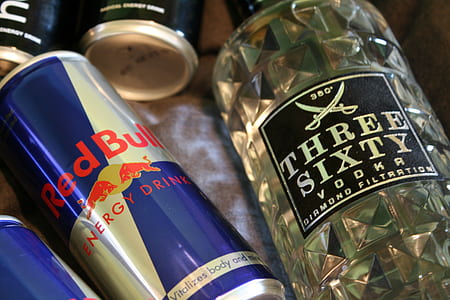 Red Bull energy drink can and Three Sixty vodka bottle thumbnail