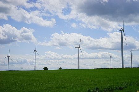 wind turbines on green grass field thumbnail