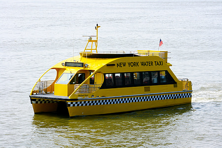 yellow New York Water Taxi boat on body of water during daytime thumbnail