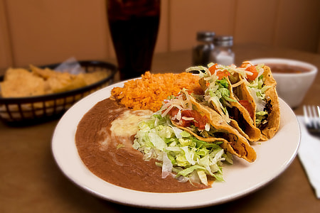 tacos with rice and sauce on plate thumbnail