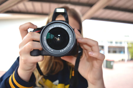 Person Holding Black Dslr Camera thumbnail