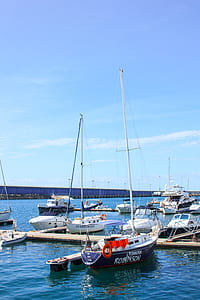 White and Black Robinson Yacht Beside Dock thumbnail