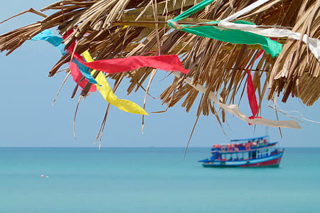 blue and red boat on body of water thumbnail