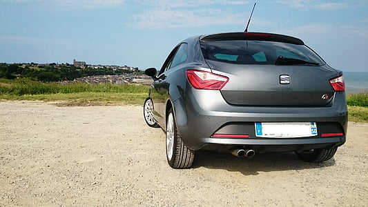gray car parked near grass field thumbnail