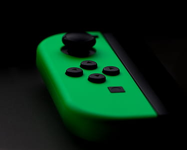 Nintendo Switch gamepad on black top thumbnail
