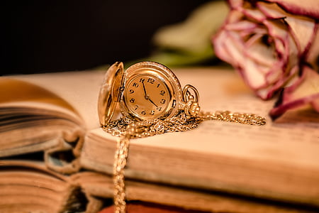gold-colored analog pocket watch thumbnail