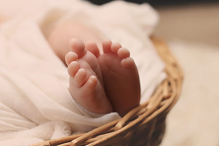 close up photo of baby feet on carrycot thumbnail