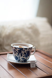tea on white and blue floral ceramic teacup thumbnail