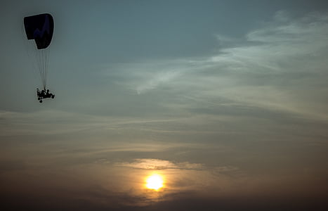 silhouette photography of person riding skydiving thumbnail